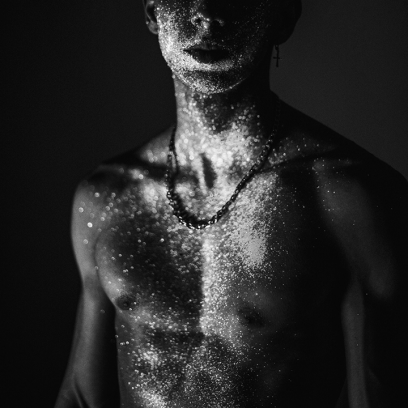 man with glitter chest