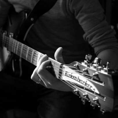 hand holding guitar