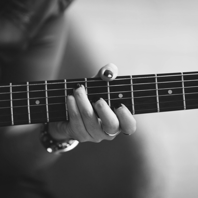 hand holding guitar